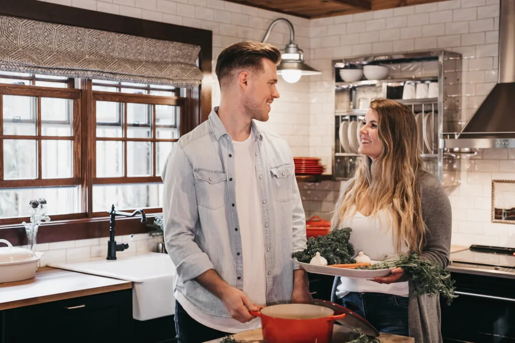 man and woman standing inside kitchen room. risks of instant attraction and instant spark.