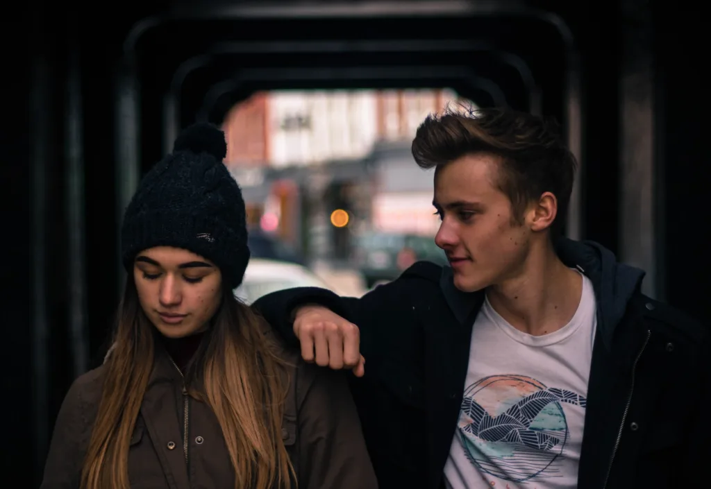 Young Couple in City at Night. Confidently connect with your crush to conquer nerves.