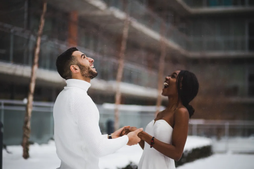man and woman in interracial relationships smiling