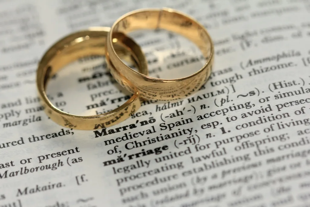 two gold-colored rings on paper. should you stay or walk away after an affair or infidelity in marriage?