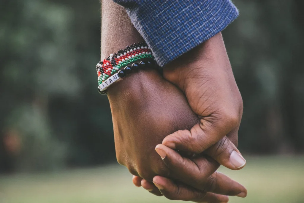 close-Up Photo of Two Person's Holding Hands. How to rebuild your relationship and rekindle your love when rebuilding your relationship.