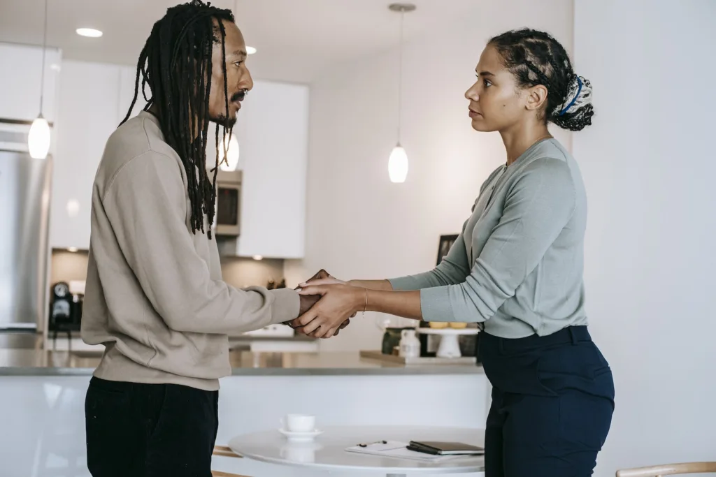 Side view positive multiethnic male client and female psychotherapist in formal clothes shaking hands and looking at each other after psychotherapy session. Rebuild your relationship and try to rekindle lost love. This is key to rebuilding your relationship