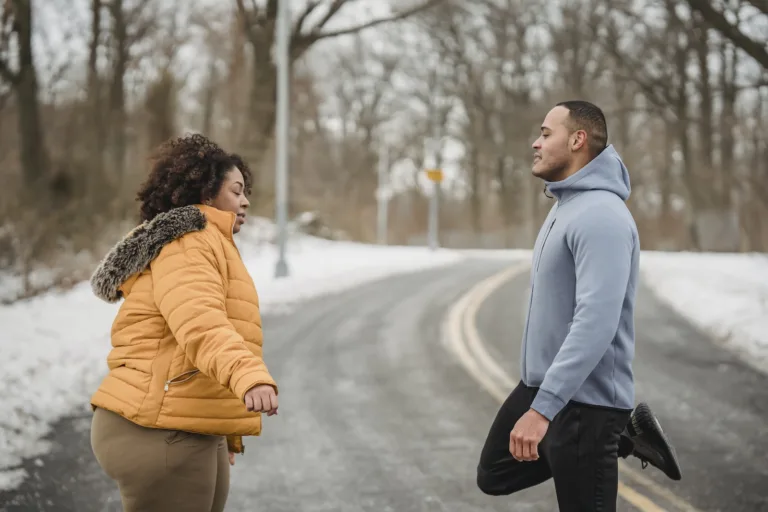 Black couple stretching in snowy park Instant attraction Instant spark Risks of instant attraction