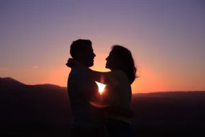 silhouette of hugging couple in intercultural relationship