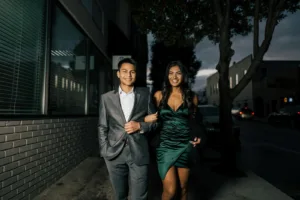 Man in Gray Suit Standing Beside Woman in Green Dress. Couples closer together, emotional connection, rekindle intimacy