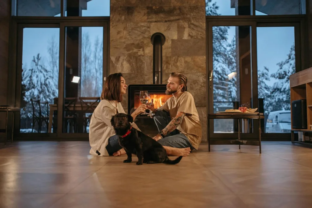 Couple with a Dog Sitting Near Fireplace. Managing expectations, romantic partnership
