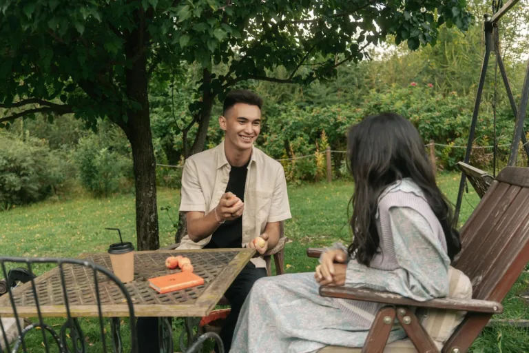 Couple Sitting on Brown Wooden Chairs. Improving communication, active listening, he is feeling attached, after sex